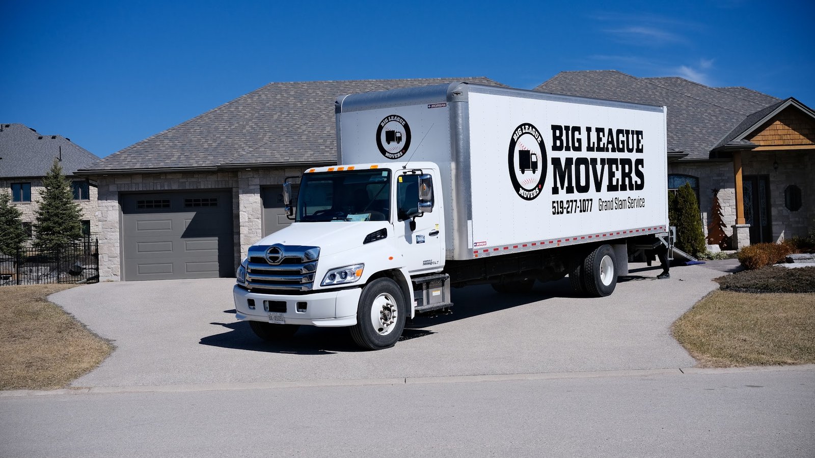 Big League Movers moving truck parked in a Barrie driveway