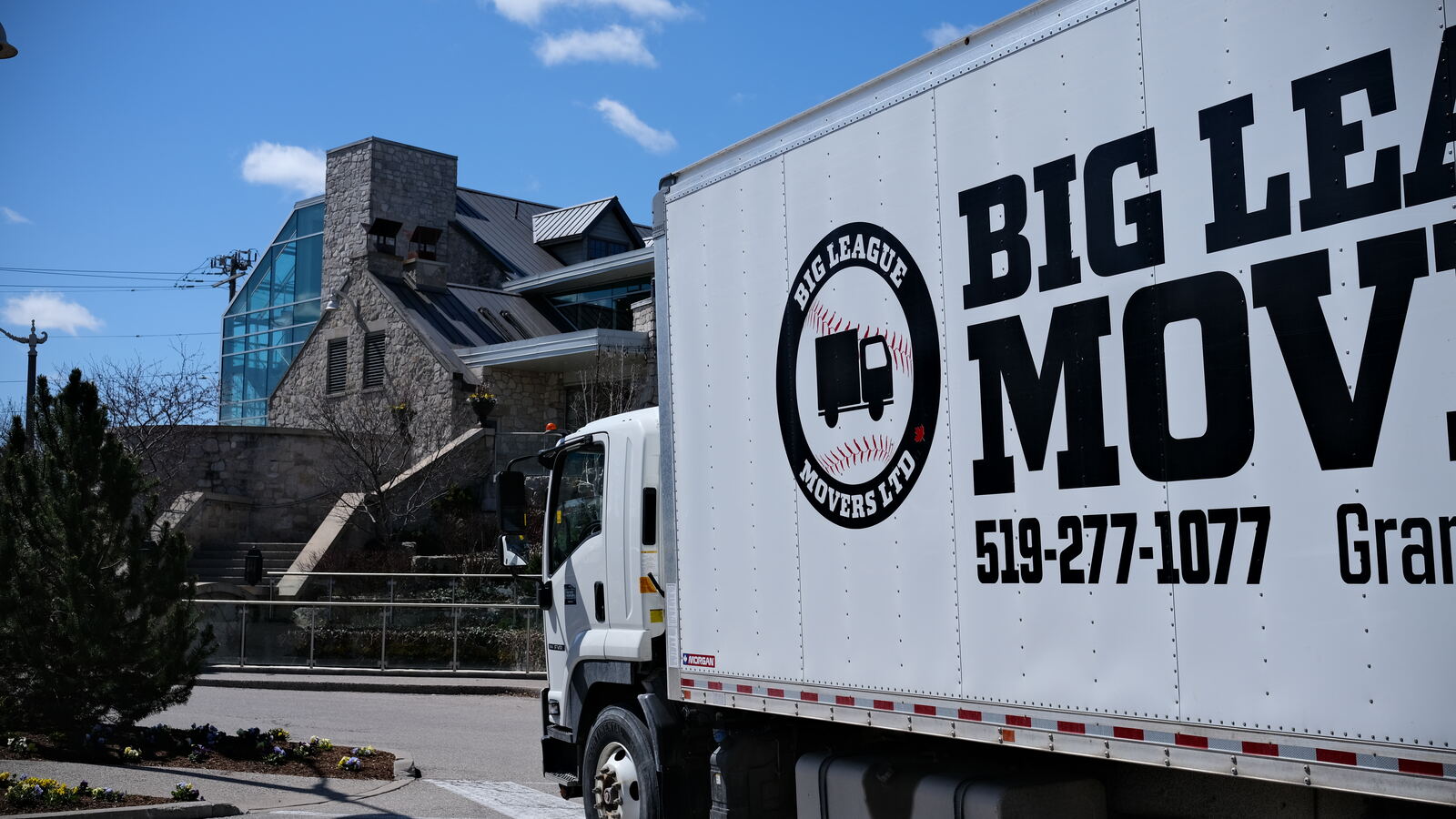 Big League Movers trucks parked on the job